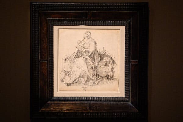 A drawing believed to be by Albrecht Dürer titled “The Virgin and Child With a Flower on a Grassy Bench” on display in London in November.